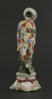 Lot 50 - An Italian Cozzi ceramic harlequin figure