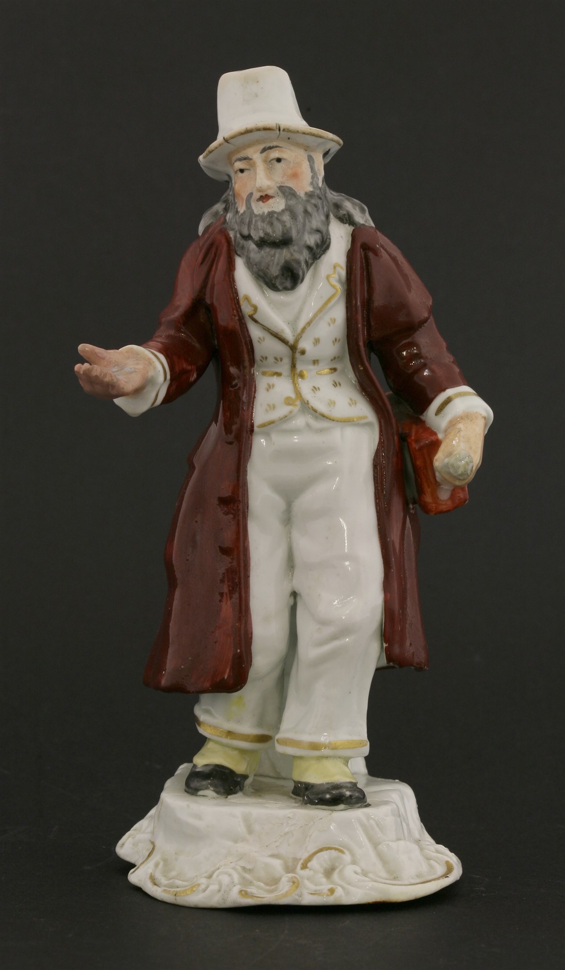 Lot 64 - A Rockingham porcelain figure