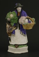 Lot 82 - A Burslem pottery figure of a greengrocer