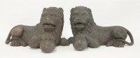 Lot 165 - A pair of carved wood lions