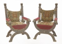 Lot 552 - A pair of X-framed oak armchairs