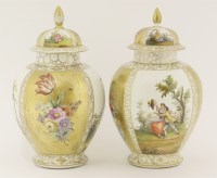 Lot 19 - A matched pair of Helena Wolfsohn vases and covers
