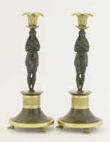 Lot 141 - A pair of Regency bronze candlesticks
