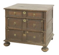 Lot 528 - An oak chest of three geometric moulded drawers