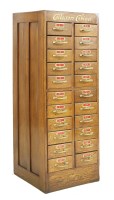 Lot 610 - An oak twenty-two drawer collector's cabinet