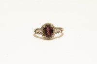 Lot 13 - A white gold garnet and diamond cluster ring