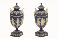 Lot 213 - A pair of 19th century Wedgwood blue Jasper 'dancing hours' mask head vases