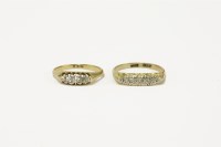 Lot 32 - Two gold five stone diamonds rings