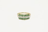 Lot 35 - A gold three row diamond and emerald ring