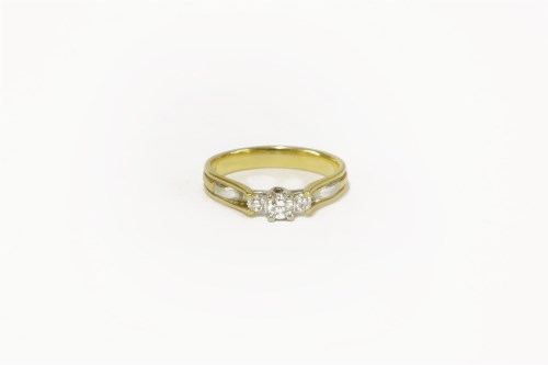 Lot 38 - A 18ct gold three stone diamond ring