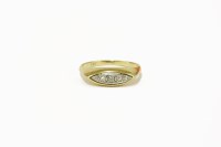 Lot 40 - a gold five stone diamond boat shaped ring
