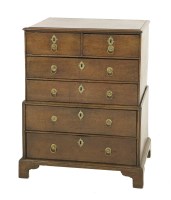 Lot 514 - A miniature oak chest on chest