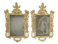 Lot 604 - A pair of George III-style carved and giltwood mirrors