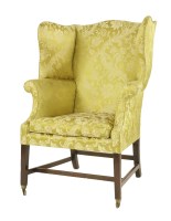 Lot 657 - An antique wing back armchair