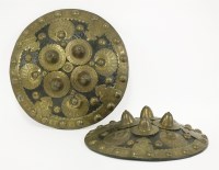 Lot 283 - Two brass-mounted North African hide shields