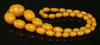 Lot 1593 - A single row graduated olive-shaped Bakelite bead necklace