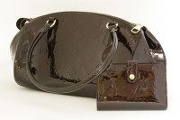 Lot 1134 - A Louis Vuitton vernis 'Sherwood PM' amarante handbag