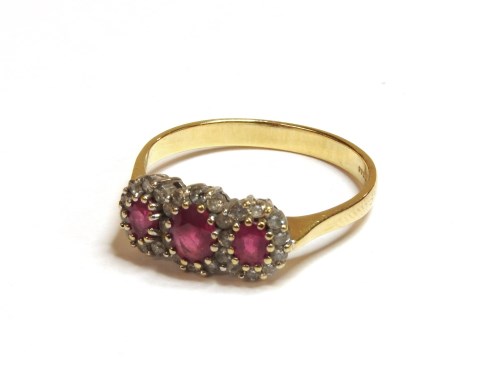 Lot 1018 - An 18ct gold ruby and diamond regal cluster ring