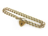 Lot 1133 - A 9ct gold double bombé curb link bracelet with padlock