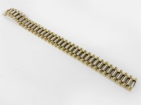 Lot 1136 - A 9ct gold two colour gold bar link bracelet (with deployant clasp)