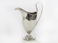 Lot 1261 - A George III silver helmet shaped cream jug