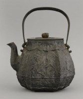 Lot 348 - A cast iron Kettle