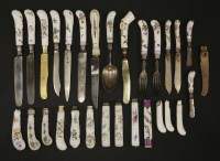 Lot 10 - A collection of knives and forks with porcelain handles