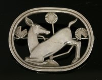 Lot 225 - A sterling silver kneeling deer brooch