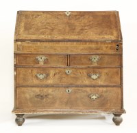 Lot 604 - An early 18th century walnut and crossbanded fall front bureau