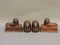 Lot 251 - A pair of 19th century treacle glazed lions