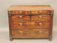 Lot 605 - A 19th century mahogany serpentine top chest of four drawers