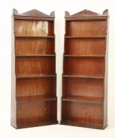 Lot 410 - A pair of mahogany 'waterfall' bookcases