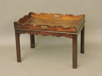 Lot 655 - A Georgian style mahogany tray top coffee table