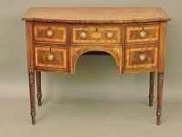 Lot 625 - A small George III mahogany bowfront sideboard