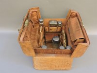 Lot 375 - An early 20th century crocodile skin dressing case