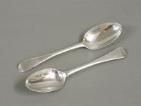 Lot 394 - A pair of Britannia standard silver Hanoverian pattern rat tail spoons