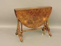 Lot 765 - A Victorian inlaid burr walnut oval sutherland table