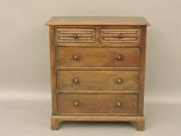 Lot 768 - A reproduction oak chest of drawers