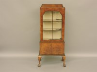 Lot 799 - A 1930s walnut display cabinet