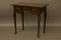 Lot 2034 - An oak low boy with three drawers