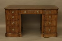 Lot 2103 - A mahogany serpentine fronted pedestal desk