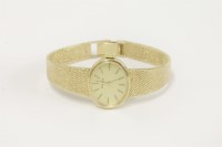 Lot 7 - A ladies 9ct gold Tissot mechanical bracelet watch