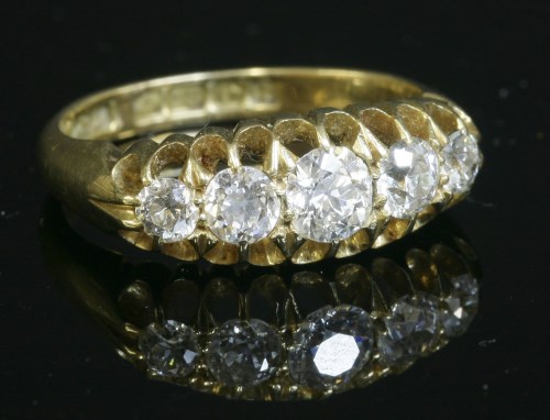 Lot 64 - An 18ct gold Edwardian five stone diamond boat-shaped ring