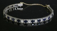 Lot 156 - An Art Deco sapphire and diamond graduated line bracelet