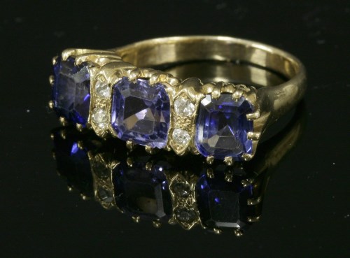Lot 173 - A three stone sapphire and diamond ring