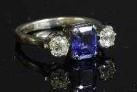 Lot 175 - A three stone synthetic sapphire and diamond ring