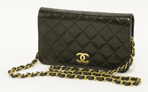 Lot 1026 - A Chanel black lambskin leather evening flap handbag