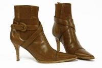 Lot 1426 - A pair of Chanel brown leather high heel boots