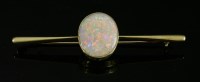 Lot 73 - A single stone opal gold bar brooch