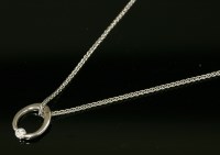 Lot 339 - An 18ct white gold single stone diamond pendant